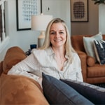 Female employee of JF Property Group, dressed professionally and providing expert real estate advice, embodying the company's commitment to exceptional client service and industry expertise
