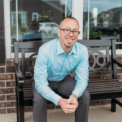 A professional male employee dressed in business attire, confidently representing JF Property Group, showcasing expertise, dedication, and commitment to exceptional real estate service.